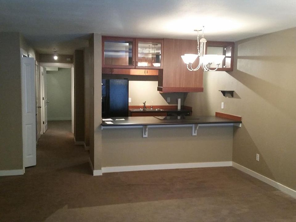 Living room looking to kitchen and bar