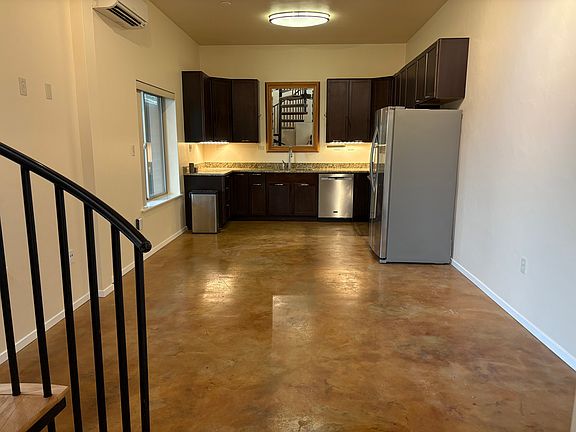 Open floor plan of living room and kitchen area.