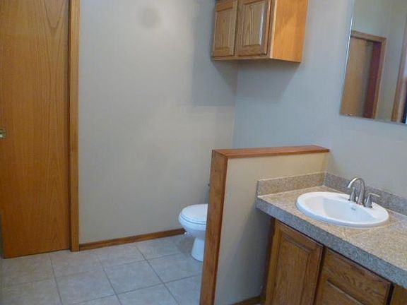 remodeled bathroom with granite countertops