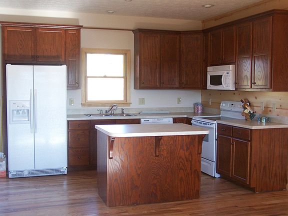 Throughout the home there is hardwood flooring.