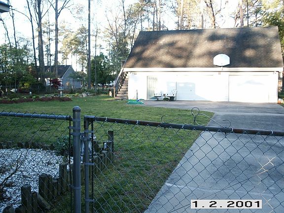 Right side-fenced backyard and shop