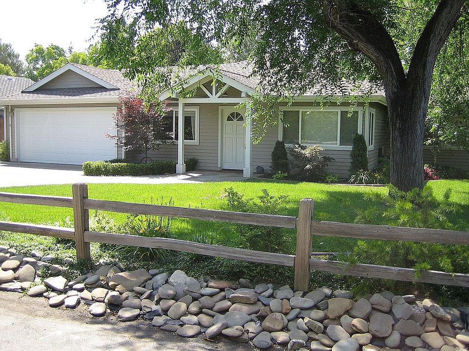 Front of the home with slate walkway, 2 car garage