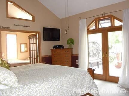 Picture of master bedroom.
						:
						French doors to deck overlooking pond and more french doors into Master bath