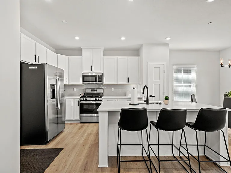 Efficient kitchen layout comes complete with basic cookware, dinnerware, coffee pot and toaster