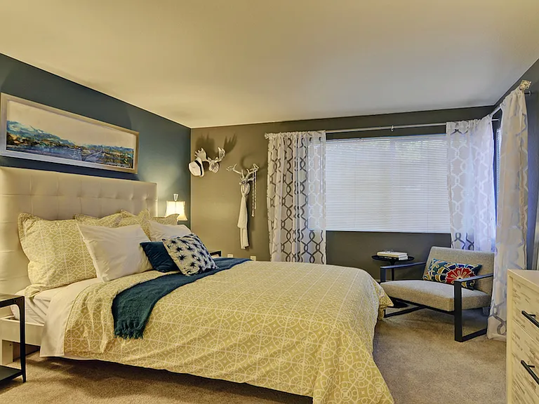 Well appointed master bedroom with oversized window