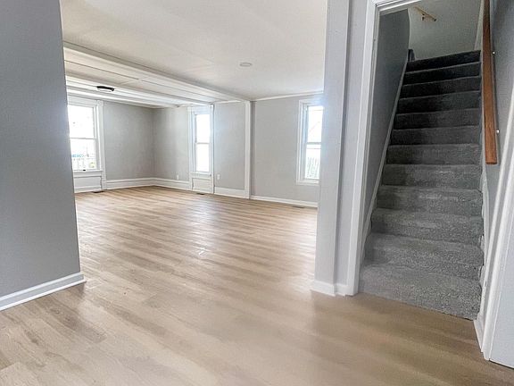 standing in the dining area looking into living room