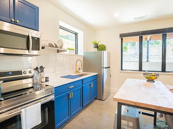 Full kitchen galley with cookware, utensils, pots & pans, and small kitchen appliances to cook to your heart's content