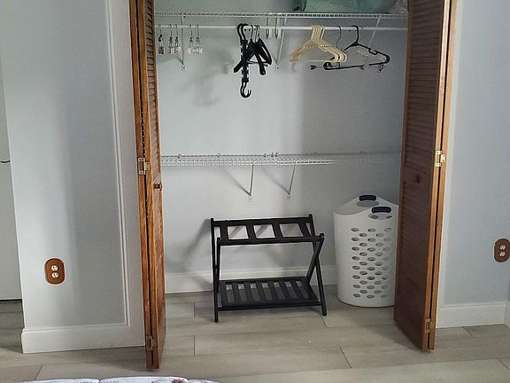 Bedroom 2 - Closet extends on both sides and is full length of wall