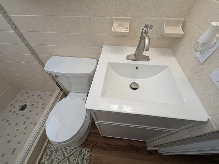 Brand new tall toilet and sink