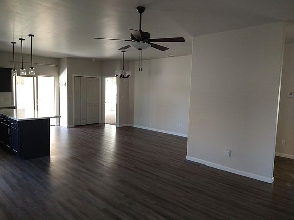 Open concept with dining area in front of the island.