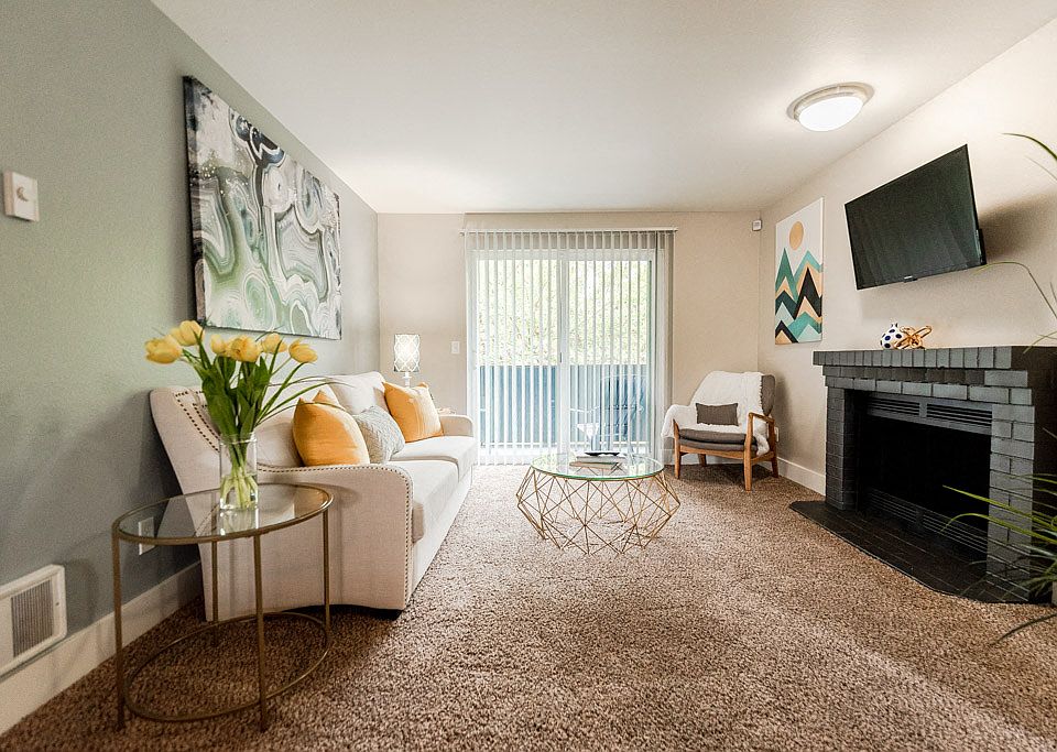 Kent Apartments - Vibe Apartments - Living Room, Deck, and Fireplace