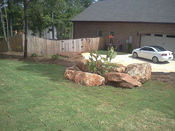 Side Yard
						:
						Smaller rock garden has butterfly bushes and cannas (and lantanas surrounding).