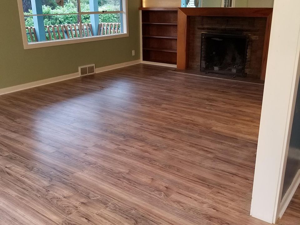 living room with vintage wood burning fireplace