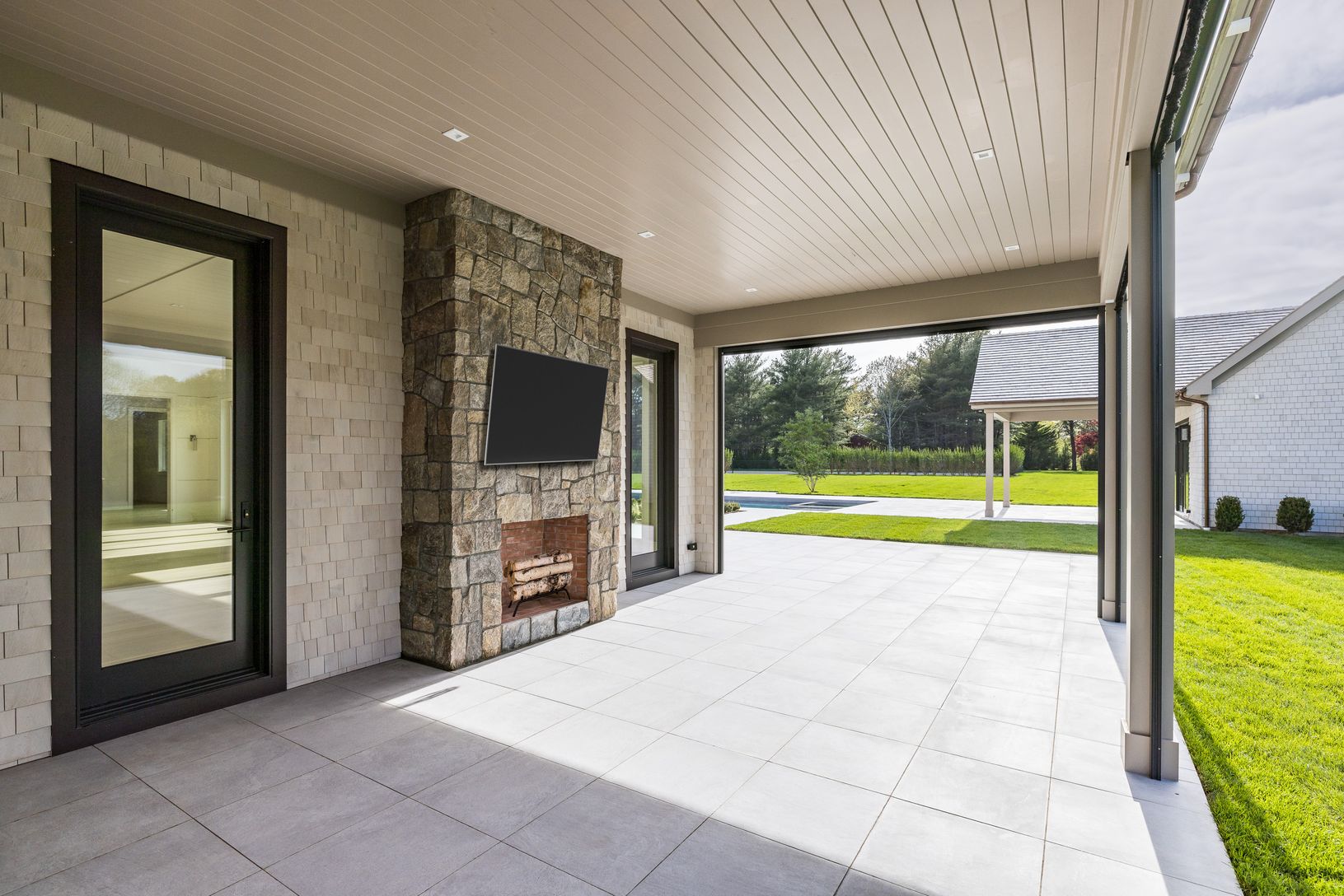 Covered Outdoor Patio with Fireplace & Retractable Screens