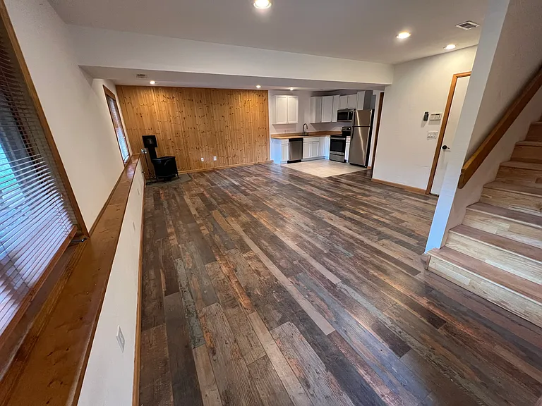 Great room on lower level from private external entrance and stairs to second-level bedrooms and bathroom!