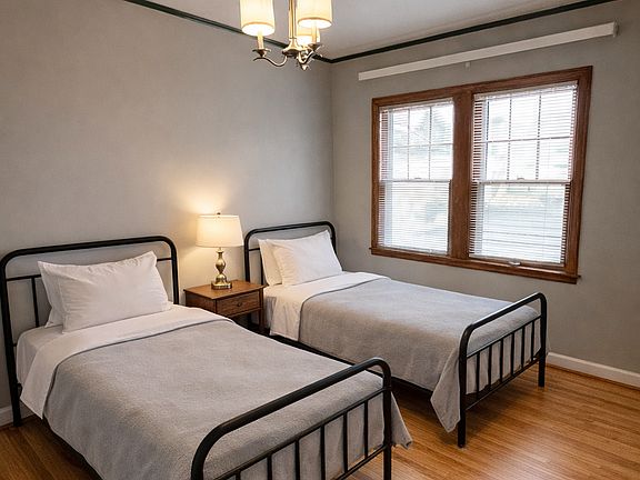The second bedroom has two twin beds in it. It also has a small closet.