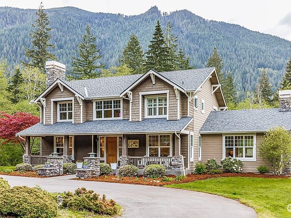 Found at the end of a gated lane, a circular drive and covered front porch welcome you to this timeless and charming craftsman home that backs up to the protected Reserve land in the community.>