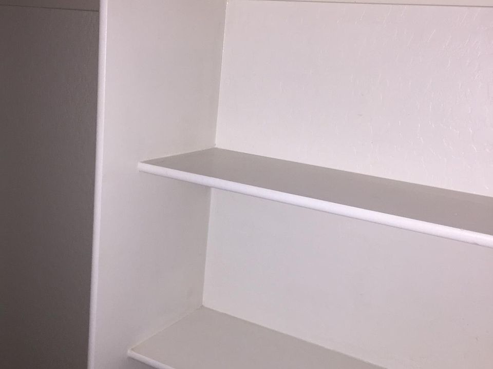 built-in shelving in hall closet