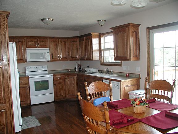 Kitchen/dining area with glass door to rear deck