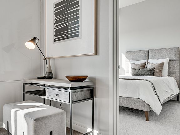 A sleek workspace meets cozy comfort, just steps from your bedroom retreat.