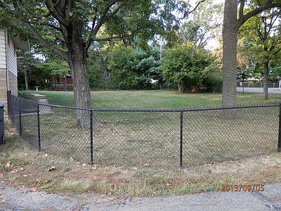 The entire front yard is fenced in.