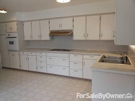 Large Country Kitchen
						:
						Custom storage, newer stove top with large eat-in area not seen here