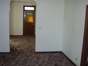 view of formal dining room thru to living room and front door