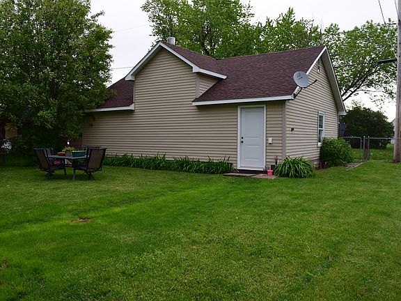 back side of garage and yard