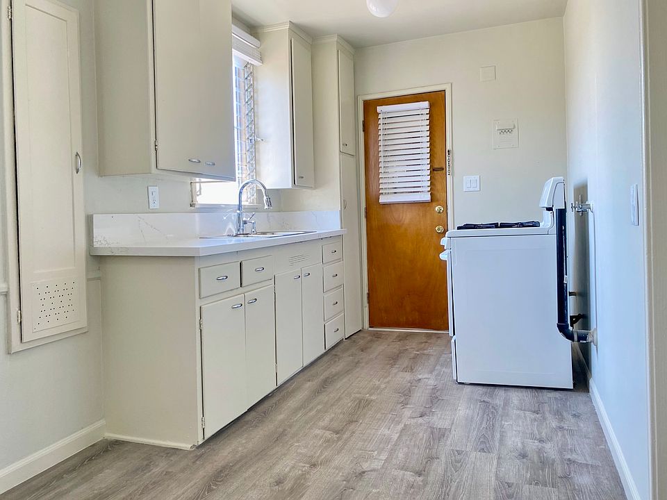 Eat-in kitchen with washer/dryer hook ups next to stove