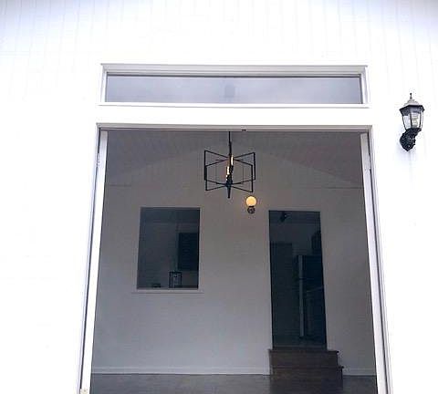 step up into your eat-in kitchen from the wide plank oak living room floor.