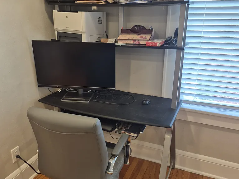 Office desk in living room for occasional work or printing.