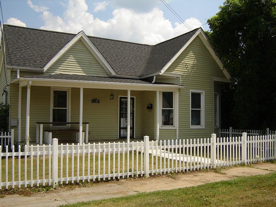 front porch with fenced in yard