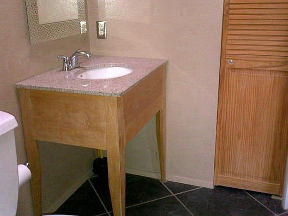 Master Bath, charcoal colored tile with solid pine vanity and granite counter top.