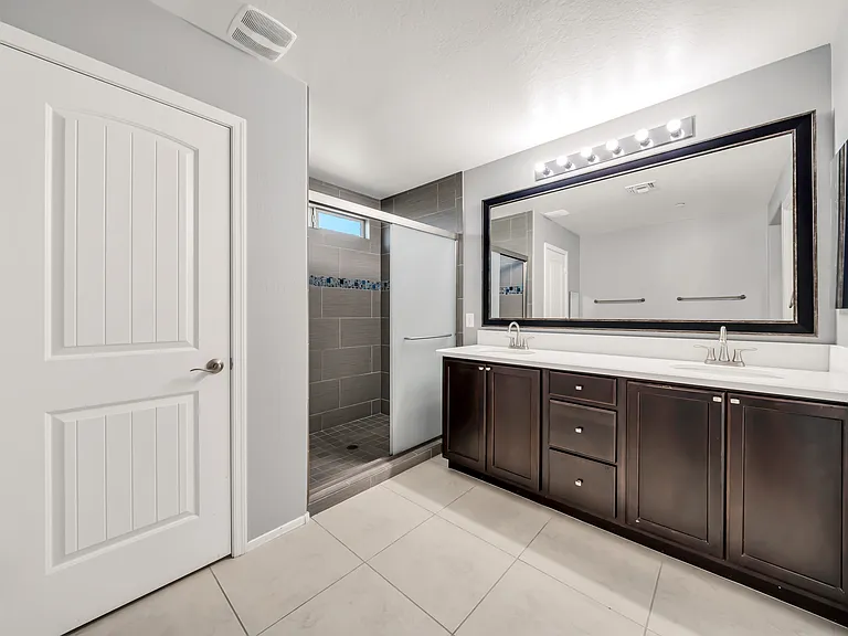 Master bathroom with dual closets