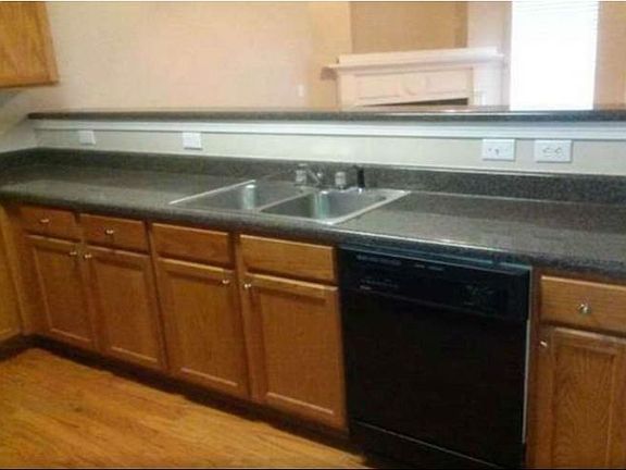 HARDWOOD FLOOR IN KITCHEN WITH FAUX GRANITE COUNTERTOP, DISHWASHER, ELECTRIC RANGE