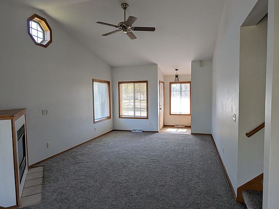 View of living room and entry from dining room.