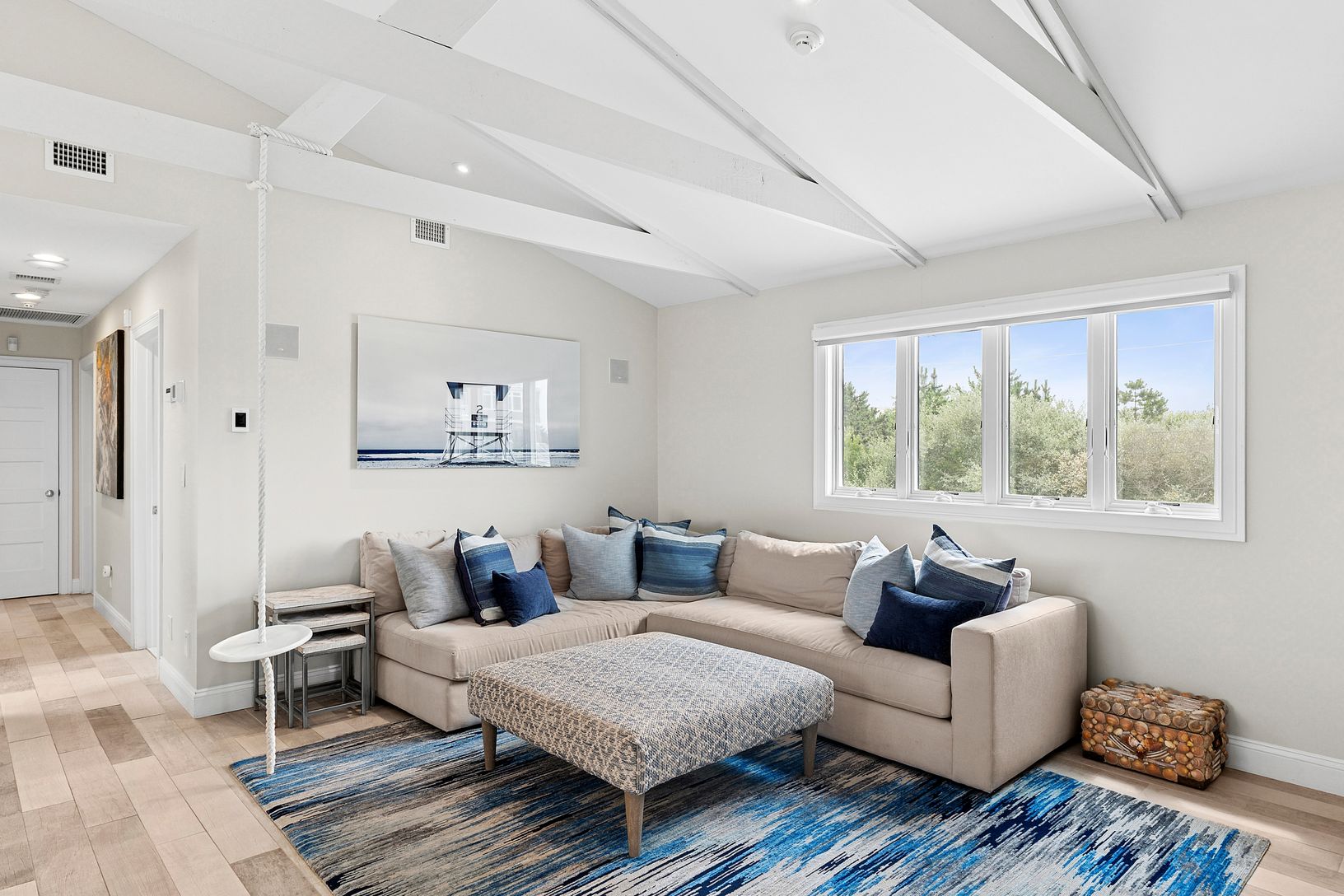 Open family room with built-in mini-fridge.