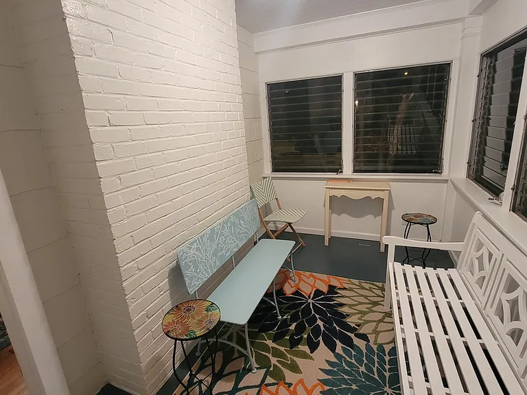 Sunroom off den with door to back yard.