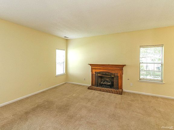 Gas log fireplace with pretty mantel in great room
