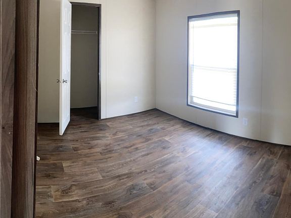 Panoramic pic of guest bedroom and guest bathroom.