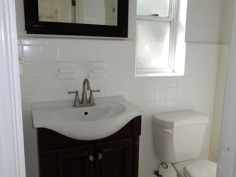 Partial view of master bathroom area.