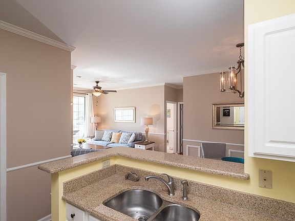 Kitchen has views to living and dining room areas