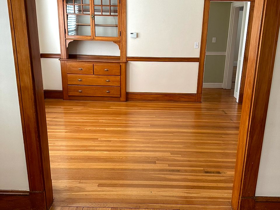 Dining room again, abundance of natural light with gleaming hardwood floors, and a beautiful custom built-in hutch.