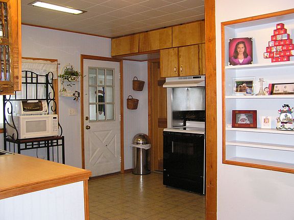 View of back door leading to enclosed porch
