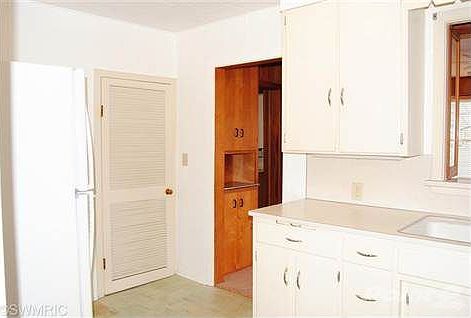 Kitchen with new refrigerator and oven