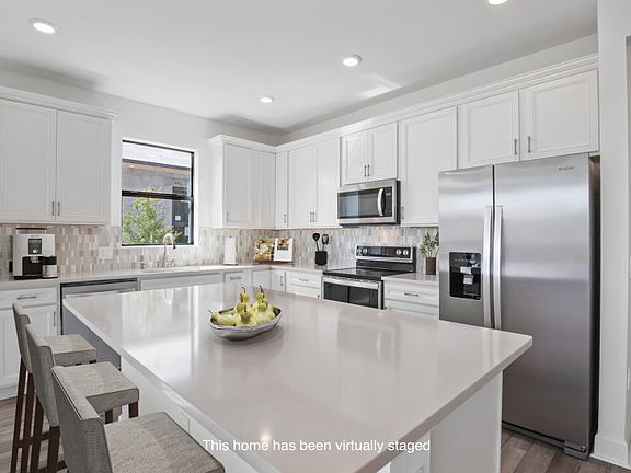 This home has been virtually staged Gourmet kitchen with stainless steel appliances