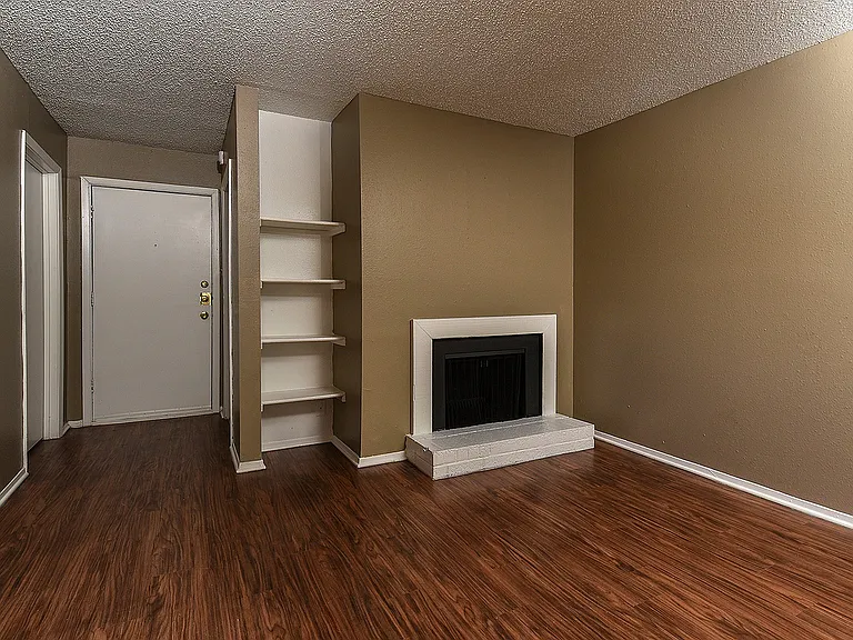 Classic - C Floor Plan Living Area with Fireplace and Plank Flooring