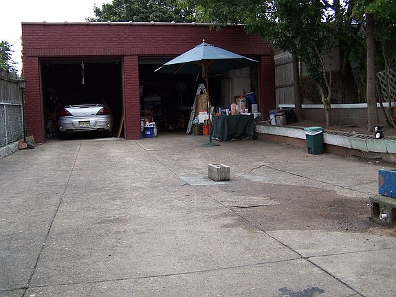 Yard with 2 detached garages