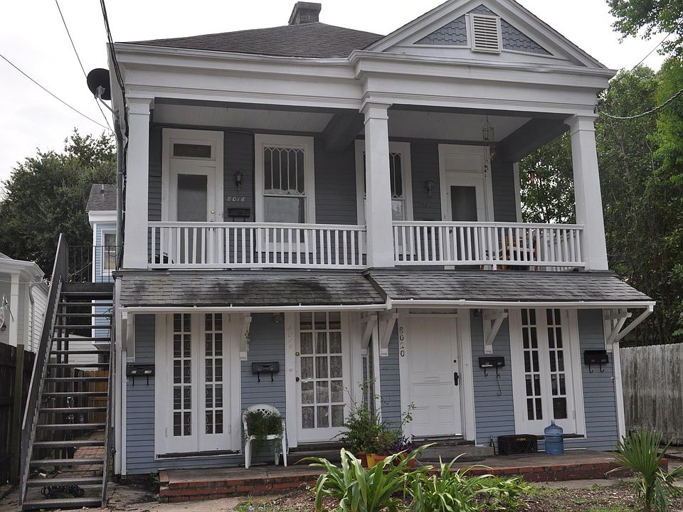 Front of house. Unit is back, right, bottom side of the house.
