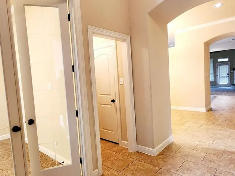 Entrance to the office and small hallway to half bath.